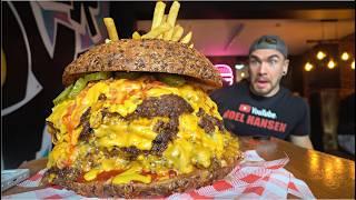 TRYING TO BEAT A 12LB BURGER CHALLENGE WITH 100 PIECES OF CHEESE | Joel Hansen