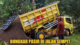 Dump Truck Unloading Sand on Narrow Road