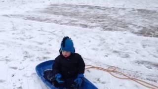 Brady Sledding in the Yard