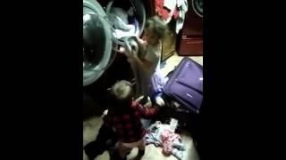 Baby helps his 4yrs old sister do laundry