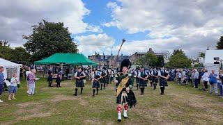 Drum Major leads Huntly Pipe Band playing King Charles III marching into 2024 Aboyne Highland Games