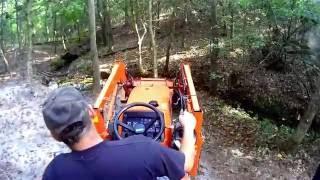 digging a small fish pond with the Kubota tractor