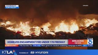 Homeless encampment erupts in flames under 170 Fwy