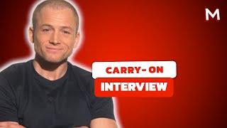 Taron Egerton Shares His Favorite Action Movies & Talks TSA Thriller 'Carry-On' | Interview