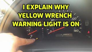 I EXPLAIN WHAT CAUSE THE YELLOW WRENCH WARNING LIGHT TO TURN ON