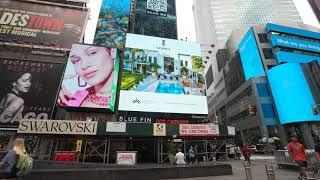 Alexander Gurman filming Times Square Billboards, square billboard on Broadway and 47th street