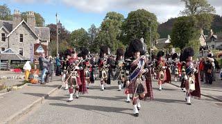 Massed Pipes and Drums march to the 2019 Braemar Gathering in Royal Deeside, Aberdeenshire, Scotland