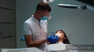 Male dentist conducting an examination of the teeth