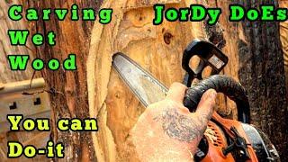 Carving an old spirit deep in fresh wet wood with chainsaws and power carving tool's. Carving Fusion