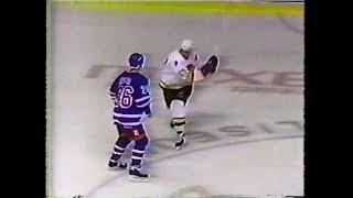 Sergio Momesso stick-swinging at Joey Kocur