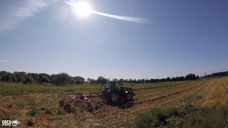 A field, a tractor, a copter