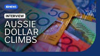 Why the Aussie dollar is expected to keep climbing in 2024 | The Business | ABC News