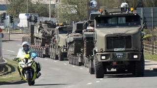 Convoys of tanks being transported for the British Army with a police escort through Wales