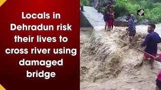 Locals in Dehradun risk their lives to cross river using damaged bridge