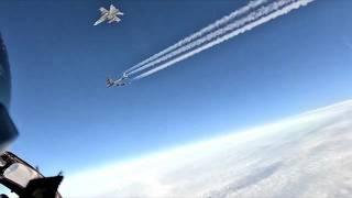 Finnish Air Force F/A-18 Hornet fighters escorting two B-52 bombers to the Rovajärvi firing range