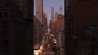 Vertical view of traffic moving on Fifth Avenue, Midtown Manhattan, New York City. Cars and taxis