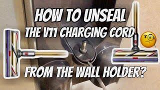 how to unseal Dyson V11 charging cord from the wall holder?