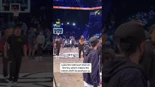 Luka hits the half-court shot, which makes the Lakers staff do pushups 