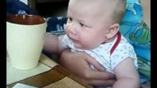 Three months, Tony tries to take a cup of coffee.What a beautiful baby