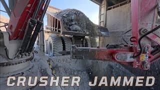 Robotic Hydraulic Arm Breaking Large Chunks of Rock Jammed in the Crusher