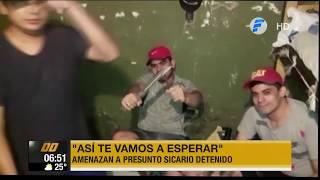 Amenazan a presunto sicario detenido