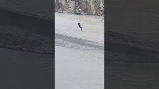 A young boy is enjoy a dangerous zip line at Hussaini Gojal Hunza