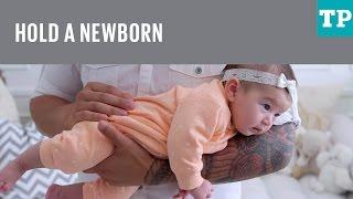 How to hold a newborn