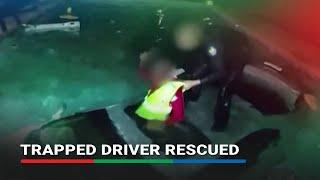 Police bodycam shows rescue of driver trapped in submerged car | ABS-CBN News