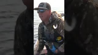 Cody Huff catching smallmouth suspended over deep water at Champlain