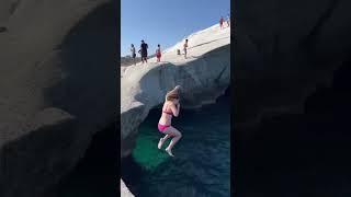 Cliff jumping at Sarakiniko Beach in Milos, Greece