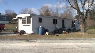 Woman rescued after getting stuck in window fleeing fire