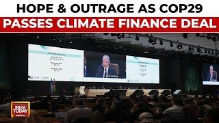 Outrage & Hope As UN Climate Summit Ends With $300 Billion A Year Climate Financing Deal