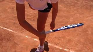 linda dubska, service training, at clay court of the Guillermo Vilas tennis academy