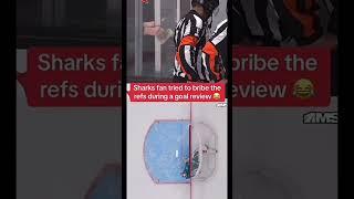 A Sharks Fan Tries to Bribe The Refs During a Goal Review