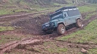 Land Rover Classic Defender 110 in Zone 4 Trenches Uphill at Dalton 4x4 Offroad