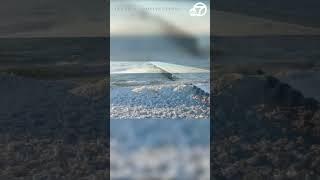 Drone video captures hypnotic icy waves crashing onto the Lake Michigan shoreline #shorts