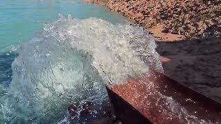 pumping water into pond slow motion