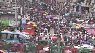 Crowds throng markets in Bangladesh ahead of Eid despite virus regulations | AFP