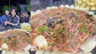 A Chinese Guy Cook Free Meals / Shrimp Meat Noodles Food for the elders on the Street in a Village