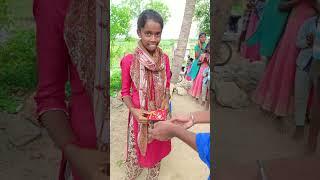 Thrilling Water Bucket Ball Challenge: Village Women Skillfully Drop Balls into Rotating Buckets