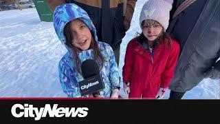 Families embrace winter activities at Calgary's Southwood Winter Fest amid cold weather