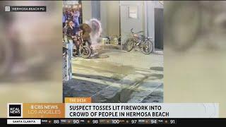 Man throws lit firework into a crowd of people in Hermosa Beach