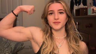 Beautiful muscle girl flexing