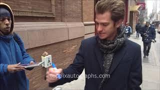 Andrew Garfield signs autographs for TopPix