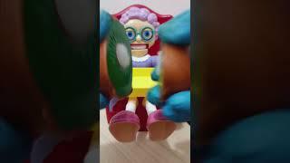 Dropping kiwi fruit (plastic)in grannys plate