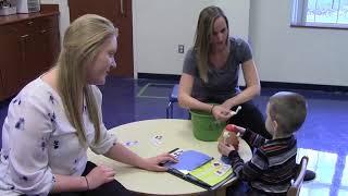 3-year-old Rage is learning to speak using his PECS book