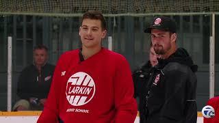 Dylan Larkin gives Brad Galli an on-ice look at his hockey school at Lakeland