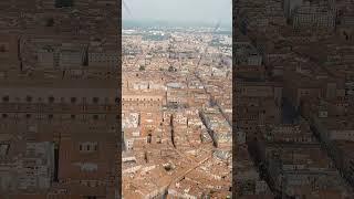 Vertical video. Bologna, Italy. Old Town. Two Towers. (Le due Torri) Garisenda and degli Asinelli...