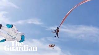 Child lifted metres into the air by giant kite at Taiwan festival