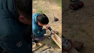 How Villagers Reinforce Logs with Metal Rings to Carry Heavy Coffins